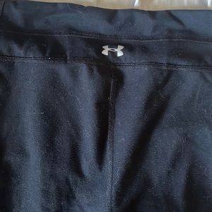 Black under armour boot cut yoga pants. Minor piling. Size LG, fits like a MD